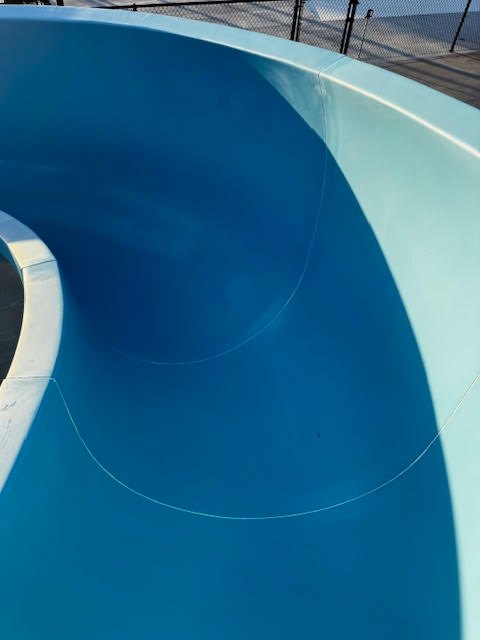 Close view of the glossy blue interior on a slide curve
