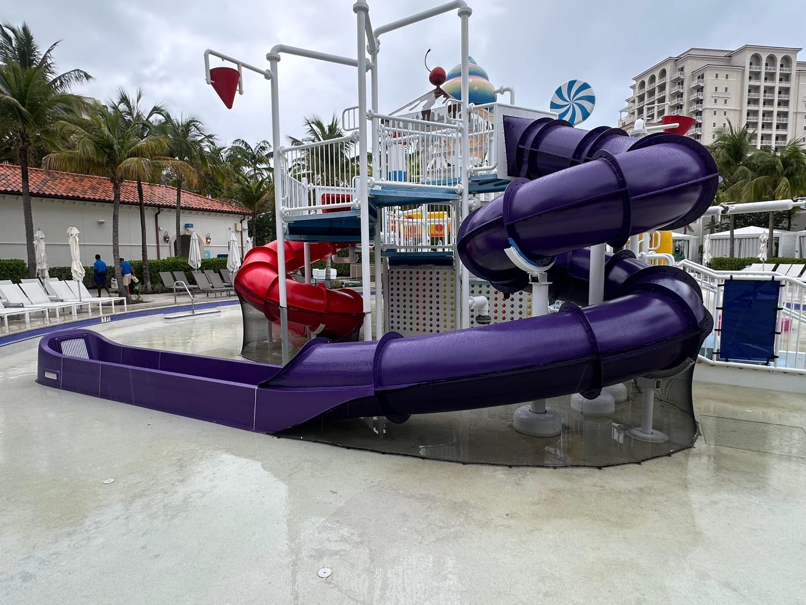 Finished purple and red slides on the kids play structure