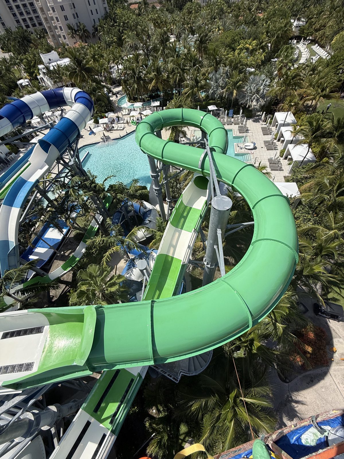 Green slide looping above the main pool at Tidal Cove