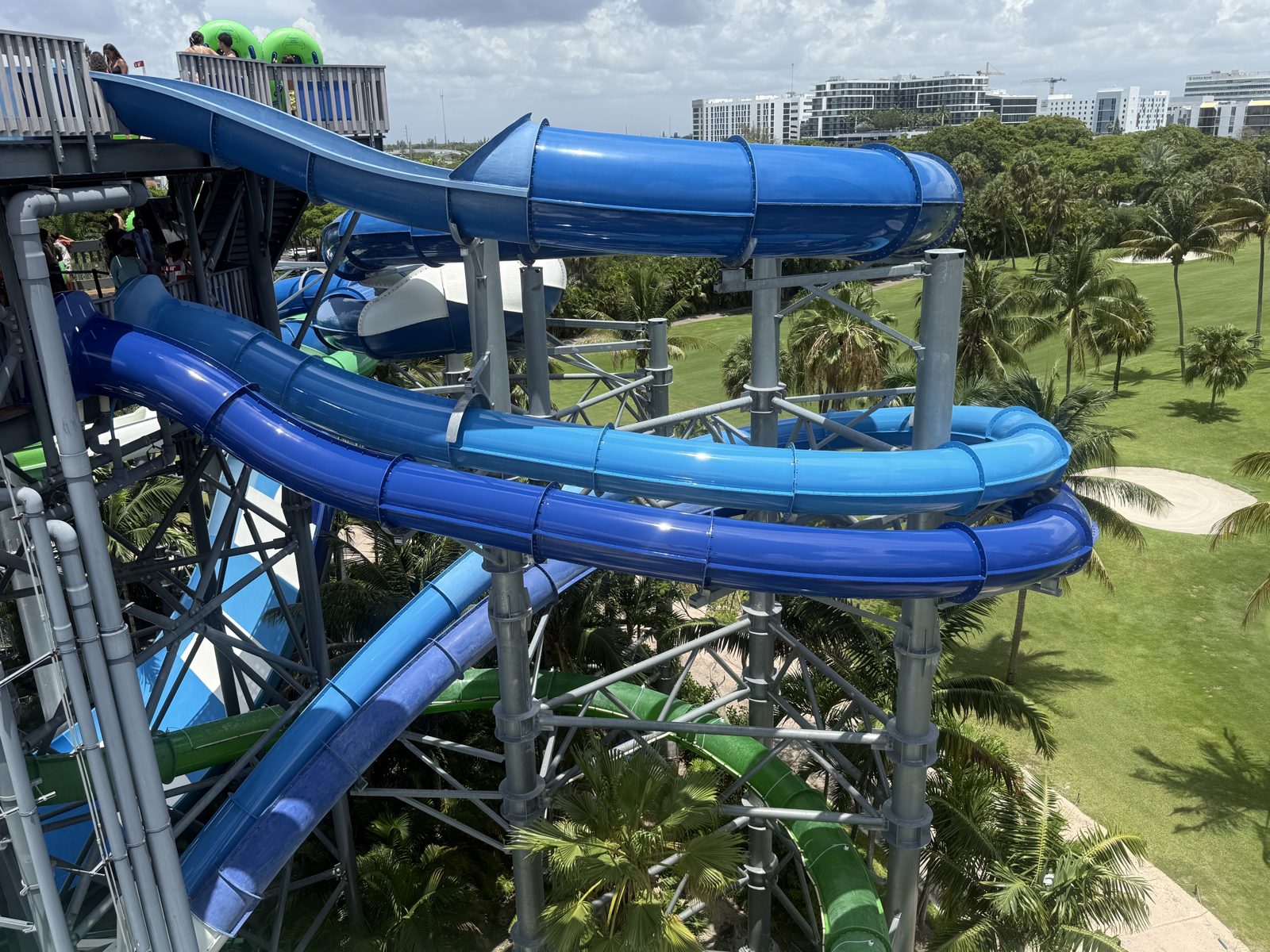 Blue slides wrapping around the tower above the golf course